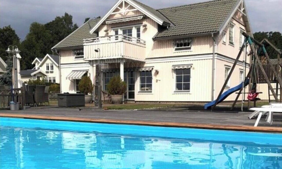 Kolmarden House | An idyllic villa on Bråviken (Lake Öster) with a large pool, a bocce court, a dock, and more