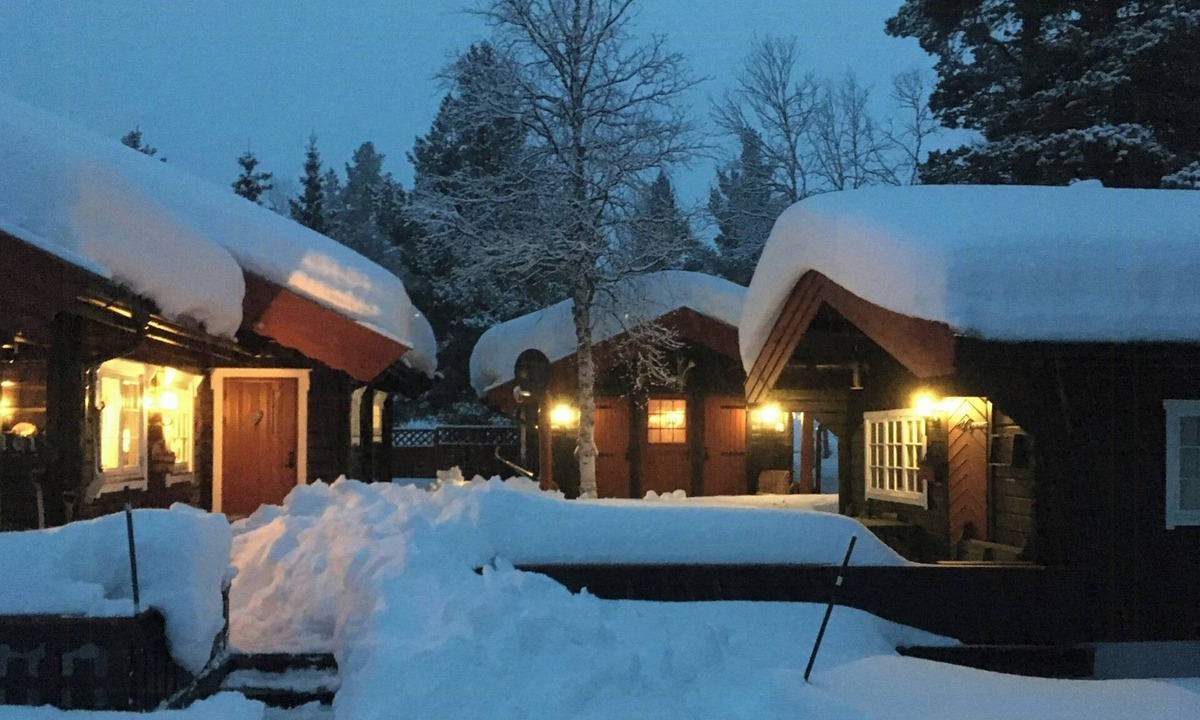 Bjorli House | Family cabin cluster by waterfall in Bjorli