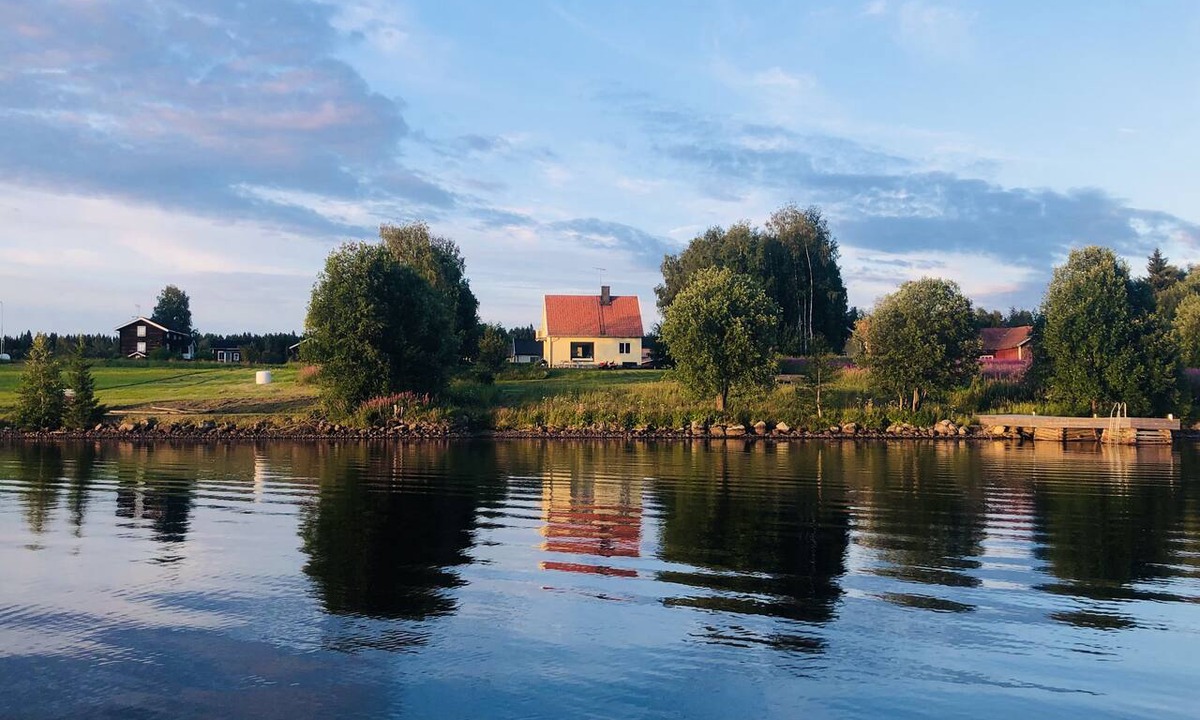 Ratan House | Lakefront house with a sauna, private dock, and rowboat