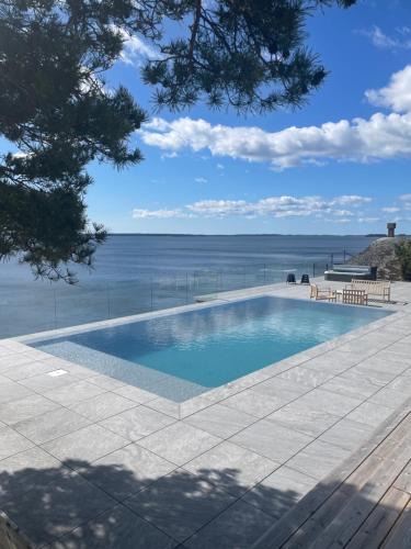 Stavsnas House | Oceanfront Retreat Heated Pool, Sauna, Jacuzzi