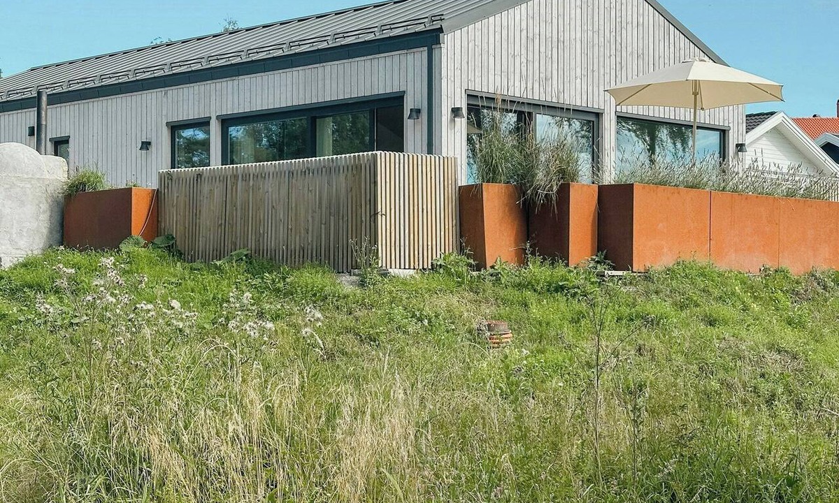 Stromstad House | Sunlit coastal cottage with a grand terrace