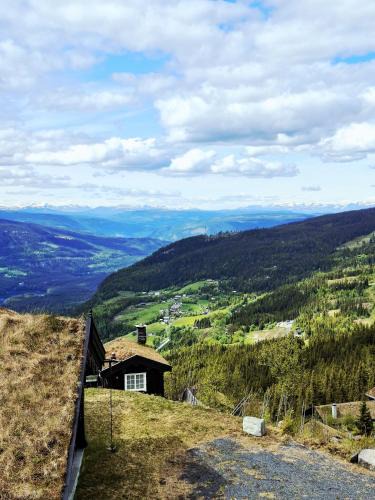 Nord-Aurdal House | Tømmerhytte i Valdres med panoramautsikt over fjellene