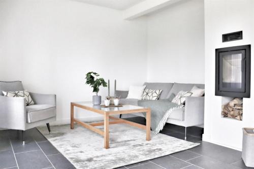 Lervik House | Terrace with Awning Pool & Tennis Fireplace