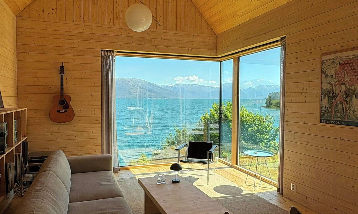 Strandebarm House | Timber cabin with private jetty by Hardangerfjord