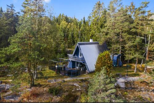 Moss House | Trekanthytte