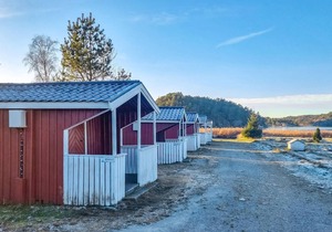 Nice small wooden cottage on natural plot by the sea fjord.