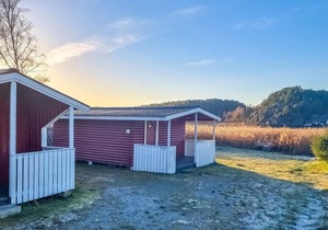 Nice small wooden cottage on natural plot by the sea fjord.