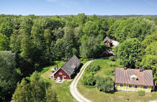 Olofstrom House | 19th century house near the lake in a forest environment