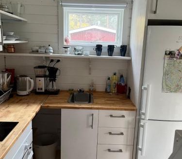 Grythyttan House | A simple stuga on a lake incinerating toilet in a separate building next to the cabin Water for drinking and washing hands dishes comes from two containers that attach to a faucet through a simple electric pump OBS no shower on site