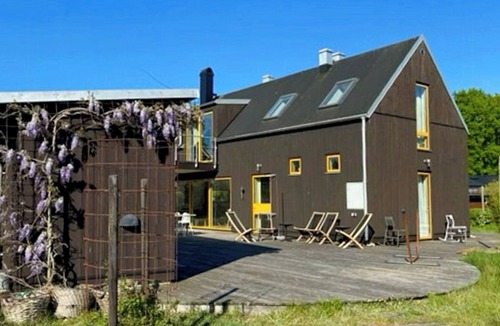 Solvesborg House | Architect-designed house with deck on peninsula