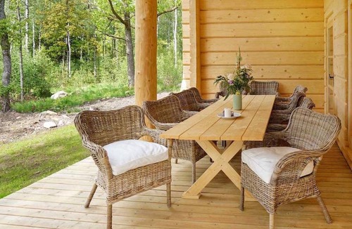 Vaxtorp Cabin | Beautiful luxury log cabin. Two private terrasses. Open fireplace. Pet friendly