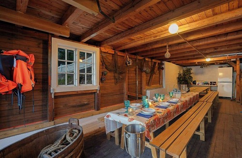 Nesoddtangen House | Boathouse with jetty and terrace views of the sea
