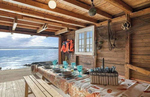 Nesoddtangen House | Boathouse with jetty and terrace views of the sea