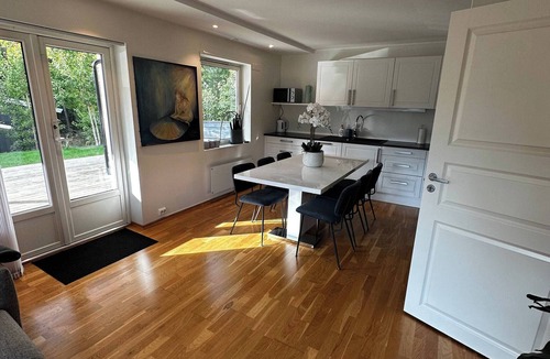 Flekkerøy Apartment | Bright Apartment with Patio and Garden