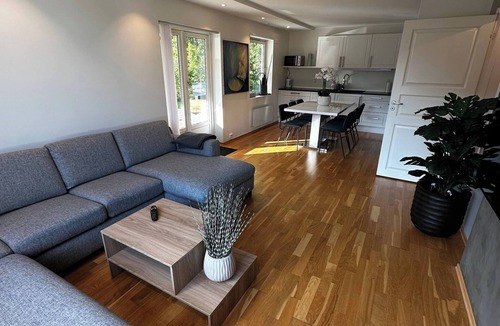 Flekkerøy Apartment | Bright Apartment with Patio and Garden