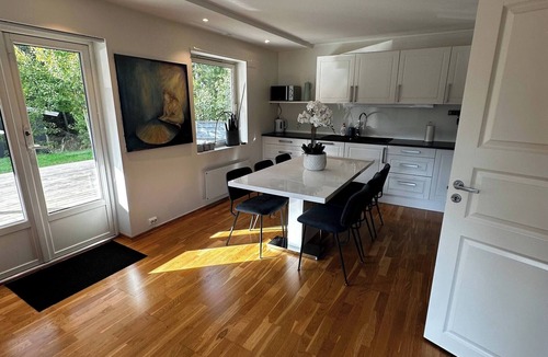 Flekkerøy Apartment | Bright Apartment with Patio and Garden