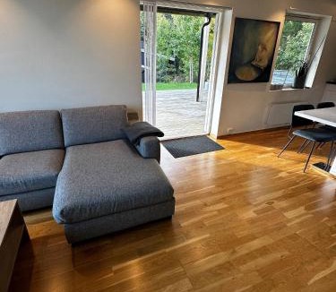 Flekkerøy Apartment | Bright Apartment with Patio and Garden