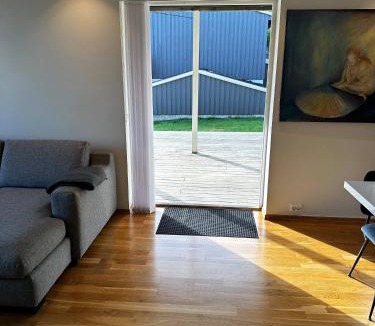 Flekkerøy Apartment | Bright Apartment with Patio and Garden