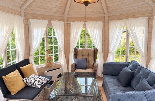 Skattungbyn House | Cozy Waterfront Cabin with Wood-Fired Sauna