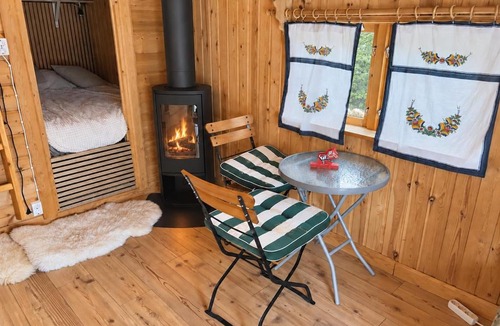Skattungbyn House | Cozy Waterfront Cabin with Wood-Fired Sauna