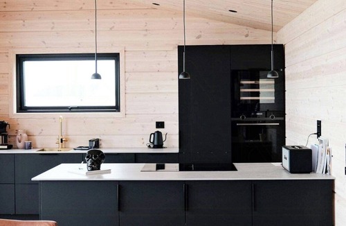 Vads House | Design cabin by the sea with Northern Lights