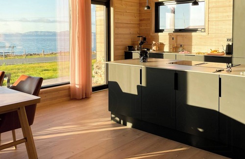 Vads House | Design cabin by the sea with Northern Lights