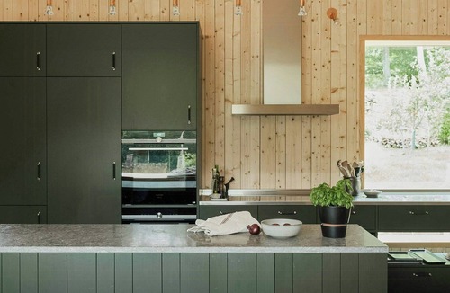 Grimeton House | Designer farm with sauna by stream in Halland