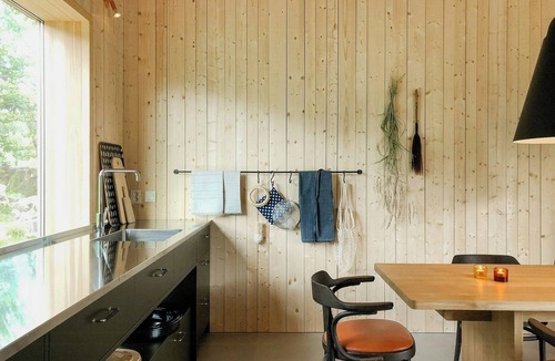 Grimeton House | Designer farm with sauna by stream in Halland