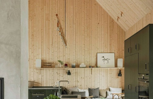 Grimeton House | Designer farm with sauna by stream in Halland