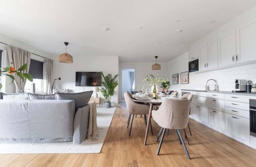 Bastad Condo | Earthy Ground Floor Home Patio Sunbeds Greenery