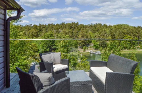 Dalaro House | Enjoy relaxing baths in the jacuzzi with sea view in this vacation home.