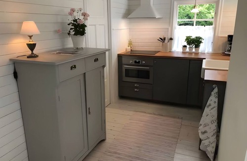 Ytterbystrand Cottage | Exclusive beach cottage with a private beach, dock, and garden