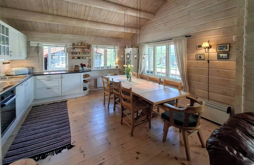 Bjorli House | Family cabin cluster by waterfall in Bjorli