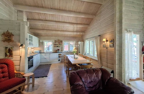 Bjorli House | Family cabin cluster by waterfall in Bjorli
