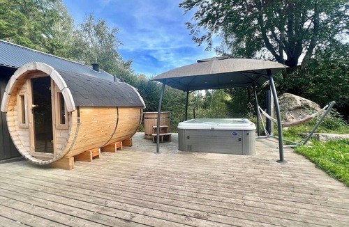 Hjarnarp Cabin | Family-friendly forest retreat with hot tub and a 4,000 m² fenced garden