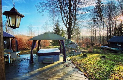 Hjarnarp Cabin | Family-friendly forest retreat with hot tub and a 4,000 m² fenced garden