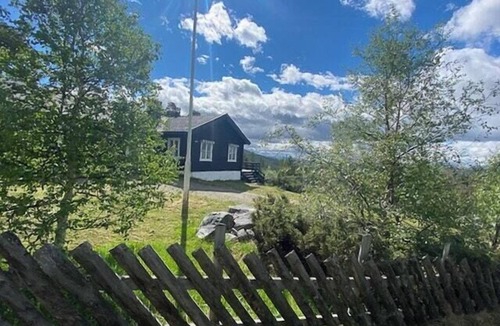 Folldal House | Historic timber cabin with views of Rondane
