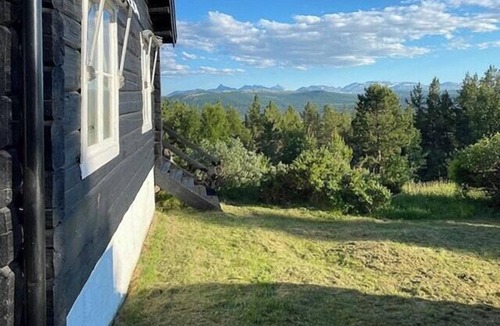 Folldal House | Historic timber cabin with views of Rondane