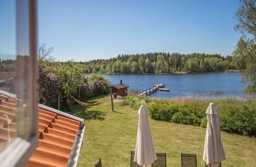 Granna Ski Chalet | Holiday home on a lake property with a own bathing area, jetty and sauna