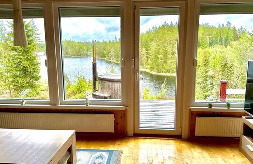 Tived House | Holiday home Tived - directly on lake, sauna, boat, hot tub