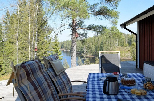 Tived House | Holiday home Tived - directly on lake, sauna, boat, hot tub