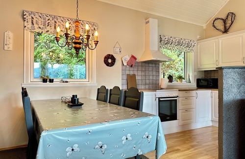 Hareid Cabin | Holiday home with view plot beyond Fjord and mountains.