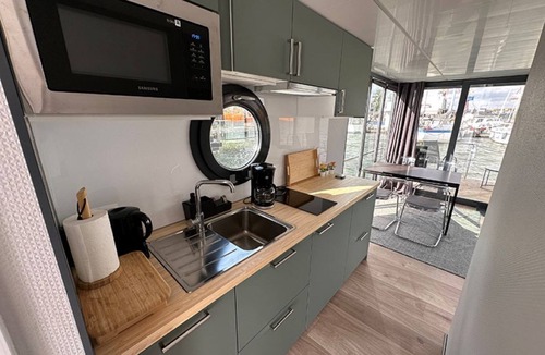 Lundby Boat Rental | Houseboat GREBBESTAD with roof terrace in the heart of Gothenburg
