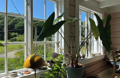 Farsund House | Idyllic farmhouse from 1840 with sea view in Spind
