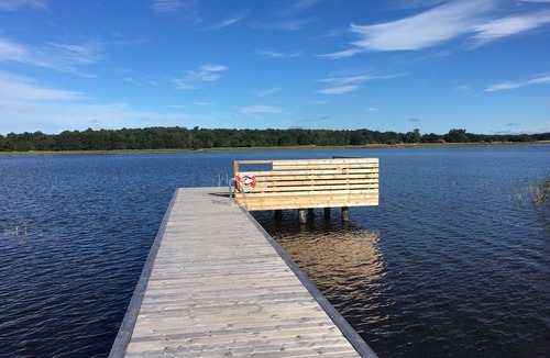 Lagersberg House | Lakeside cabin with a private dock, boat, sauna, and large garden with a barbecue area