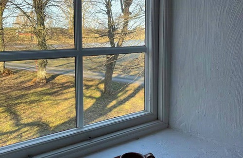 Nar House | Limestone house with park-like garden in När