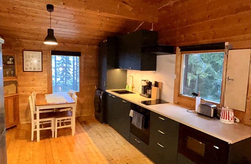 Rautavaara Cabin | Log cabin by the lake in Finland: 2 wooden saunas, hot tub, private beach