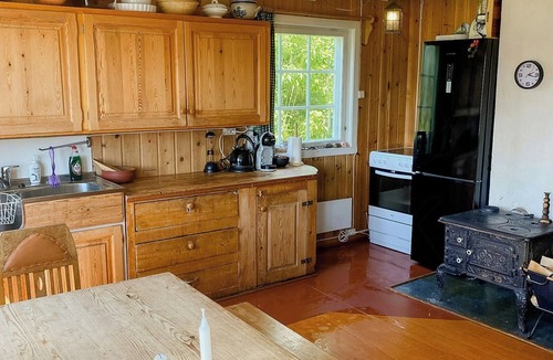 Austbygde House | Log cabin with view of Gaustatoppen
