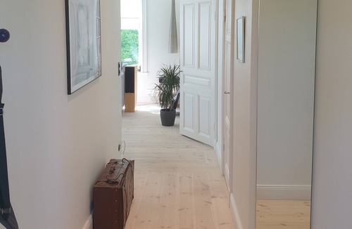 Solna Apartment | Modern apartment in 19th-century villa close to city, sea and royal gardens.