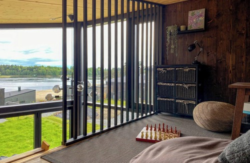 Nes Municipality House | Modern comforts and river views at Oppaker